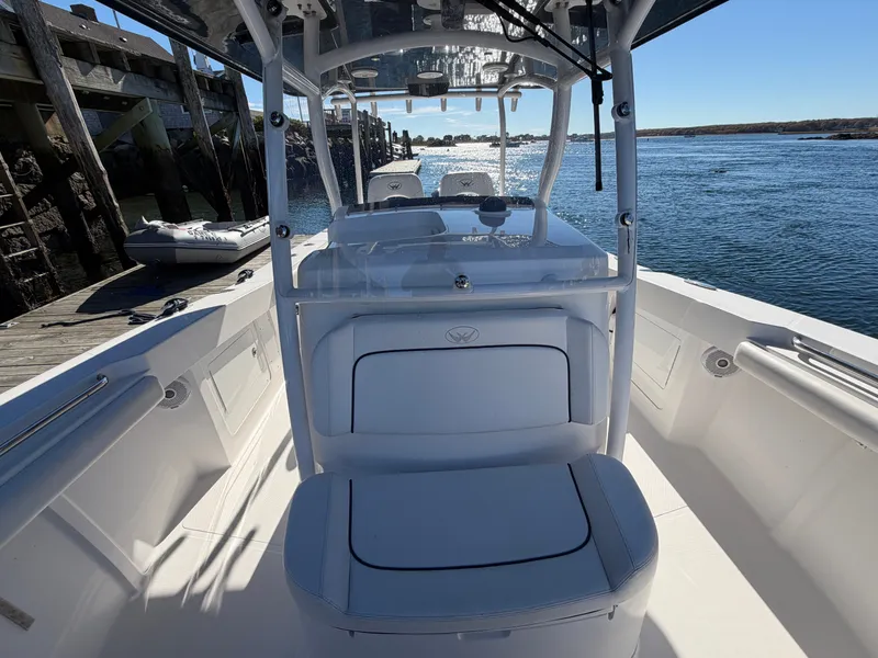Slide: The Image of The image shows the cockpit of a 2016 Southport 33 FE boat on the water. - 11