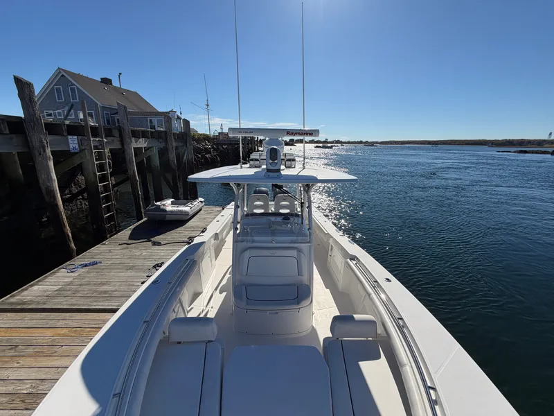 Slide: The Image of A 2016 Southport 33 FE docked at a wooden pier in a calm harbor. - 10