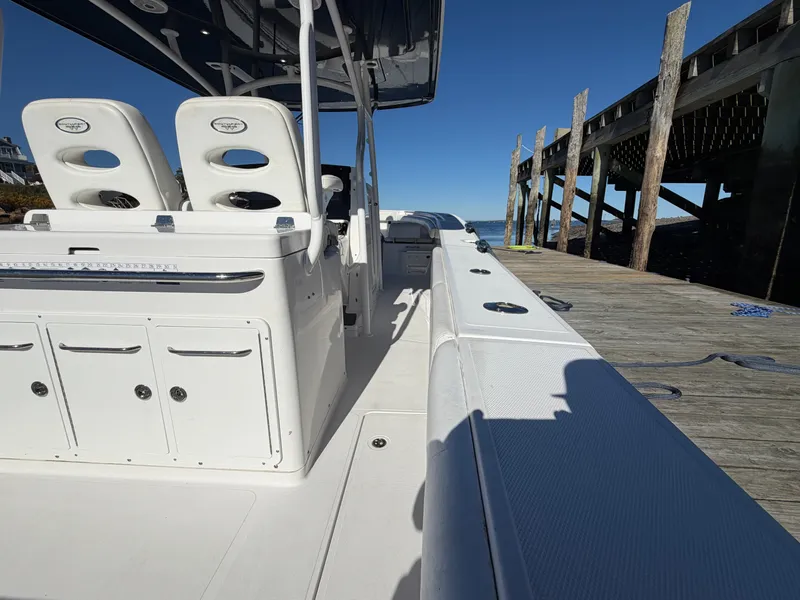 Slide: The Image of The image shows a 2016 Southport 33 FE boat docked at a pier. - 6