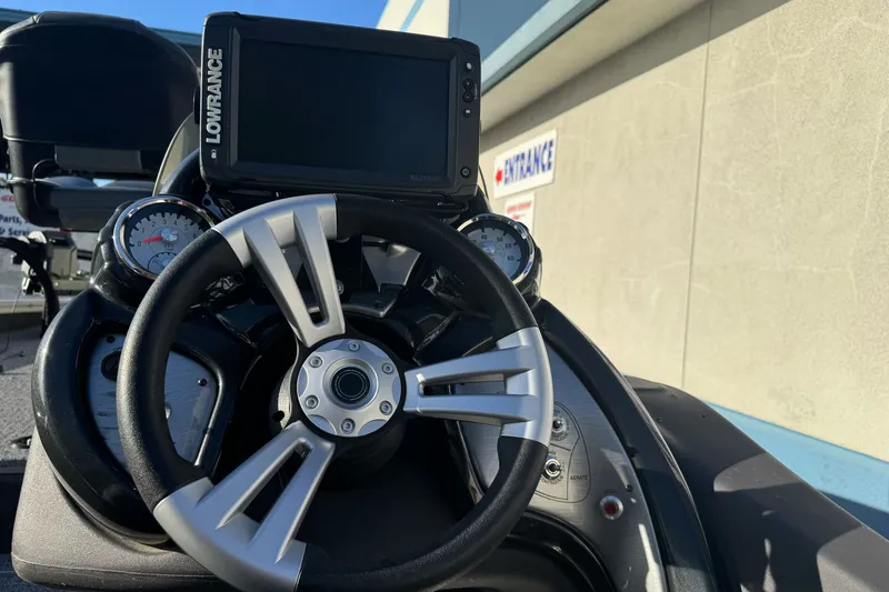 Slide: The Image of 2020 Tracker Pro Team 175 boat dashboard with steering wheel and Lowrance display. - 13
