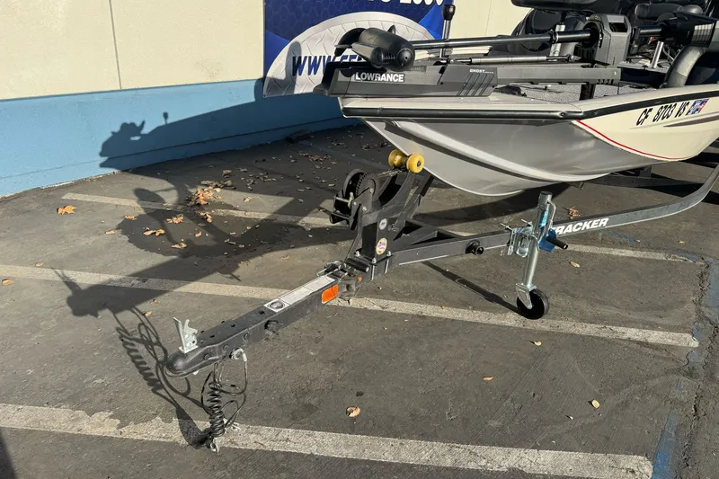 The Image of 2020 Tracker Pro Team 175 boat on trailer in parking lot. - 0