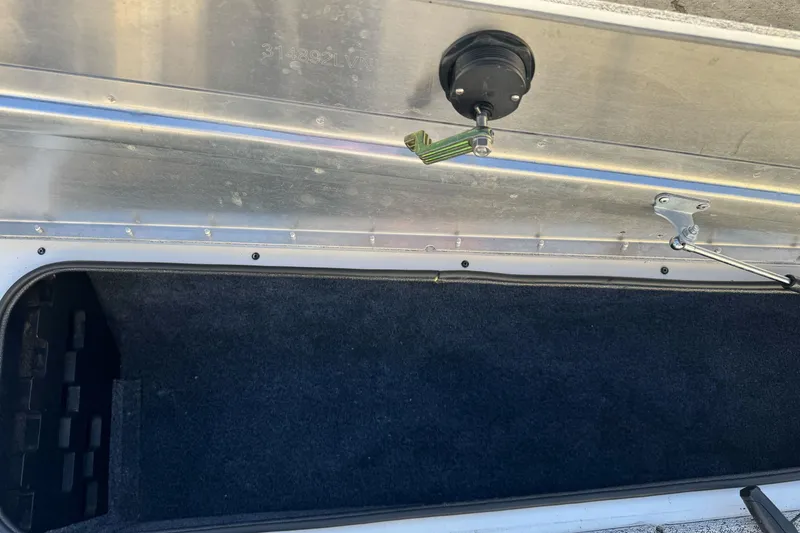 Slide: The Image of Open storage compartment in 2020 Tracker Pro Team 175 boat. - 17