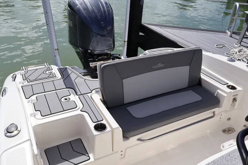 Slide: The Image of 2023 NauticStar 251 Hybrid boat with Yamaha engine and cushioned seating. - 18