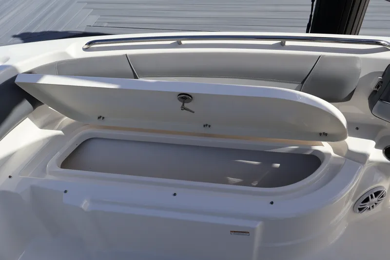 Slide: The Image of Open storage compartment on 2023 NauticStar 251 Hybrid boat. - 29
