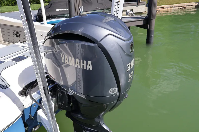 Slide: The Image of 2023 NauticStar 251 Hybrid with Yamaha 300 outboard motor on green water. - 35