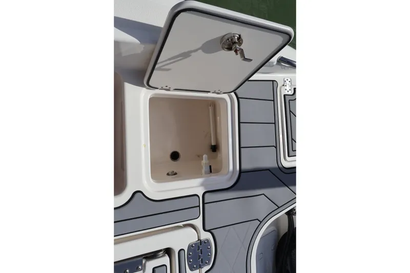 Slide: The Image of Open storage compartment on 2023 NauticStar 251 Hybrid boat deck. - 24