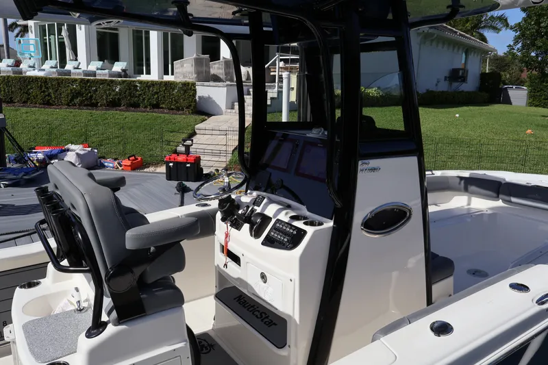 Slide: The Image of 2023 NauticStar 251 Hybrid boat interior with modern helm and seating. - 41