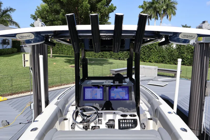 Slide: The Image of 2023 NauticStar 251 Hybrid boat cockpit with advanced navigation system and sleek design. - 28