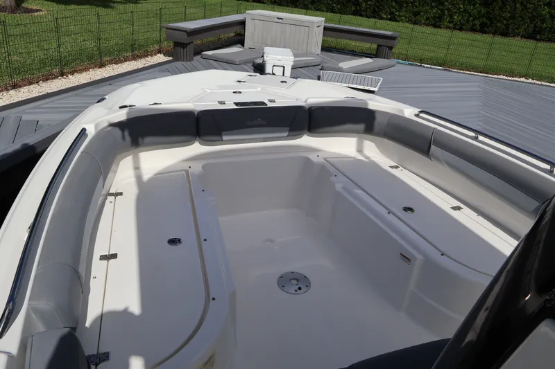 Slide: The Image of 2023 NauticStar 251 Hybrid boat interior with spacious seating and storage compartments. - 16