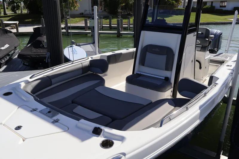 Slide: The Image of 2023 NauticStar 251 Hybrid boat interior with cushioned seating and modern design. - 45