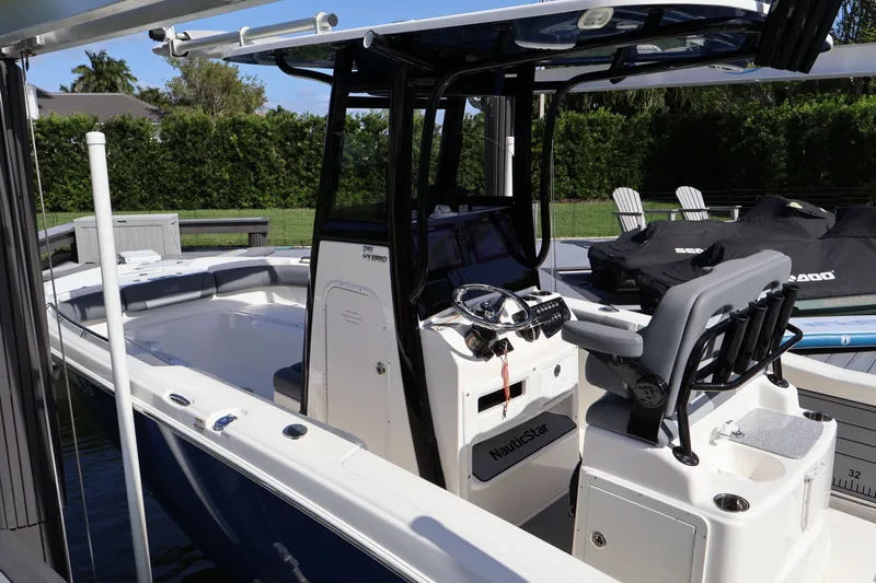 Slide: The Image of 2023 NauticStar 251 Hybrid boat with sleek design and modern cockpit features. - 42