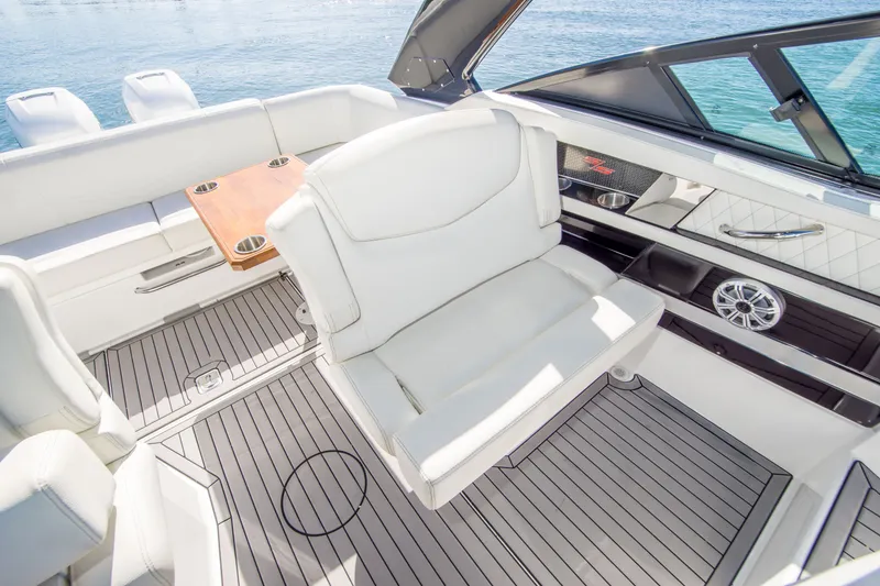 Slide: The Image of Luxurious interior of 2020 Cruisers Sport Series 338 Bow Rider with white seating and wood accents. - 11