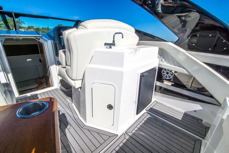 Slide: The Image of 2020 Cruisers Sport Series 338 Bow Rider interior with seating and amenities. - 16