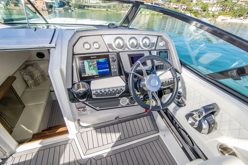 Slide: The Image of Cockpit of 2020 Cruisers Sport Series 338 Bow Rider with modern controls and navigation displays. - 20