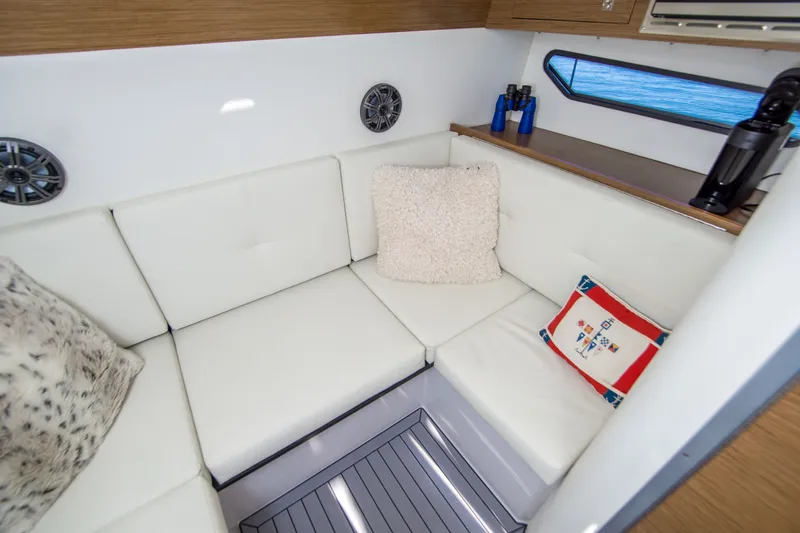 Slide: The Image of Luxurious interior of 2020 Cruisers Sport Series 338 Bow Rider with plush seating and decor. - 35