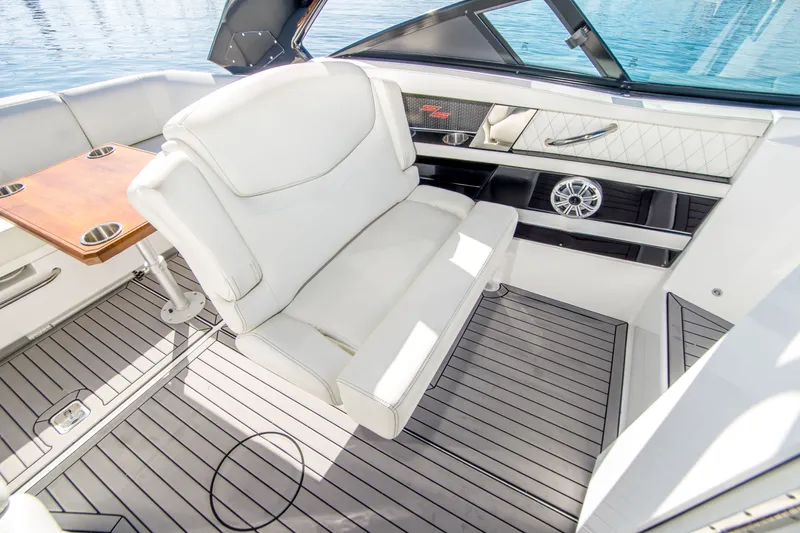 Slide: The Image of Luxurious interior of 2020 Cruisers Sport Series 338 Bow Rider boat with white seating. - 17