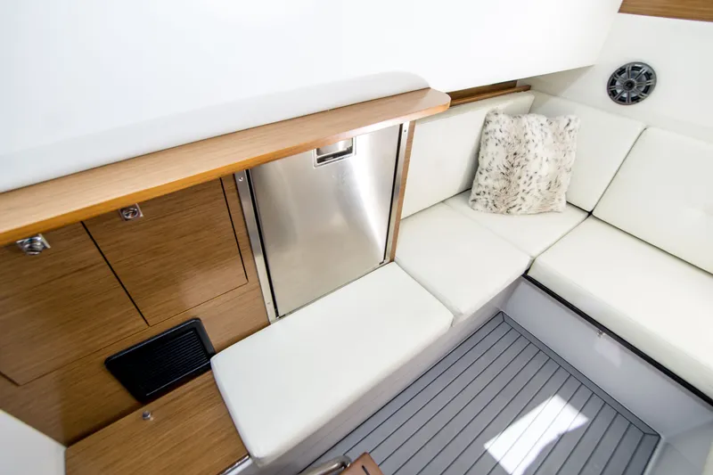 Slide: The Image of Luxurious interior of 2020 Cruisers Sport Series 338 Bow Rider with white seating and wood accents. - 36