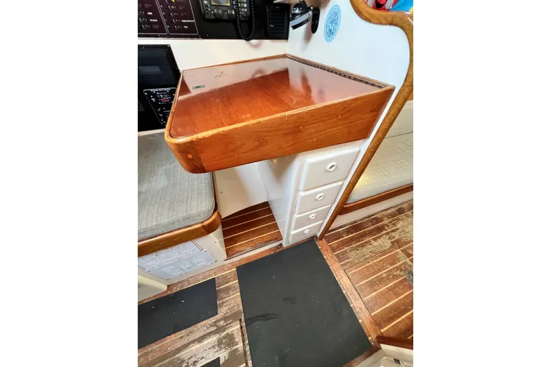 Slide: The Image of Interior of 1975 Cape George 36 sailboat with wooden desk and drawers. - 46