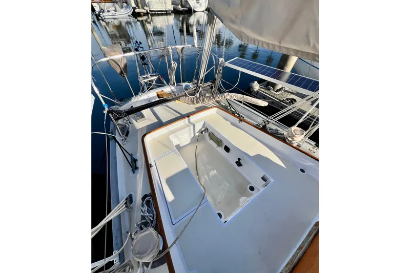 Slide: The Image of 1975 Cape George 36 sailboat deck with rigging and marina view. - 33