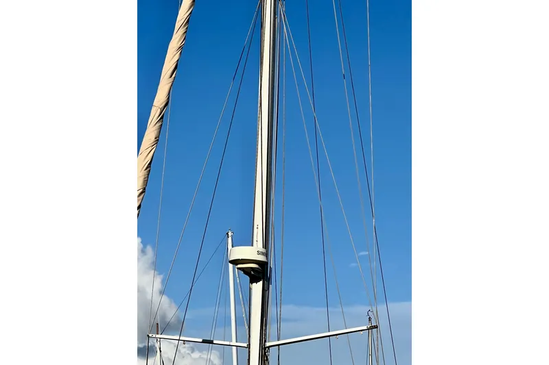 Slide: The Image of Mast of 1975 Cape George 36 sailboat against clear blue sky. - 36