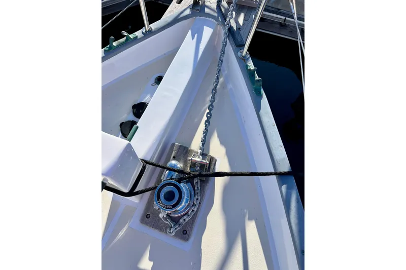 Slide: The Image of Bow of 1975 Cape George 36 sailboat with anchor chain and winch. - 26