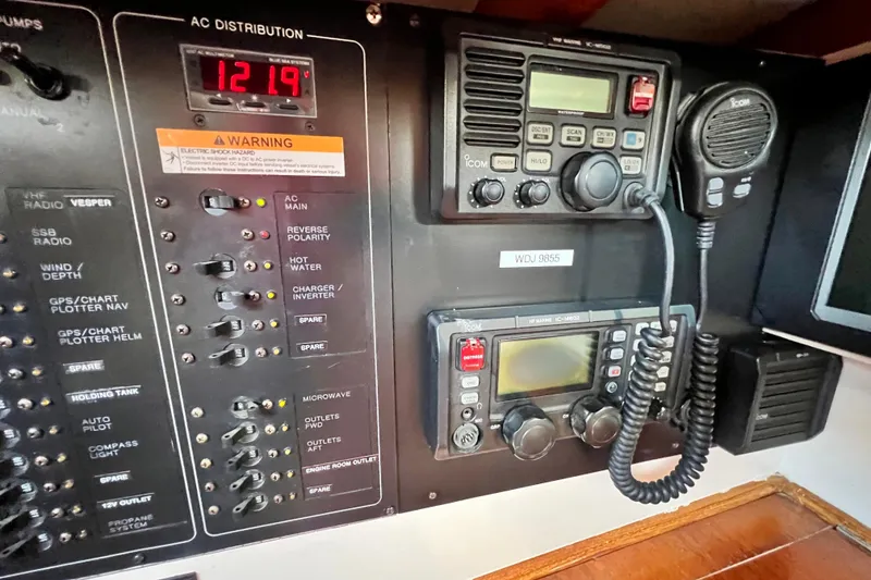 Slide: The Image of Electrical control panel and radio equipment on a 1975 Cape George 36 sailboat. - 48