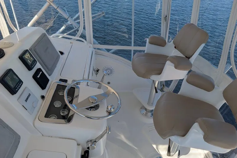 Slide: The Image of Helm of 2006 Tiara Yachts 3900 Convertible with dual seats and navigation equipment. - 13