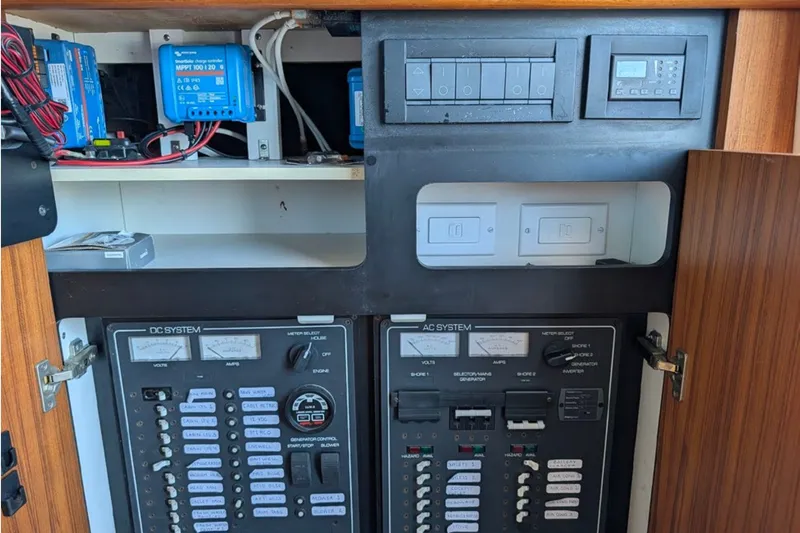 Slide: The Image of Electrical panel of a 2006 Tiara Yachts 3900 Convertible, showcasing AC and DC systems. - 19