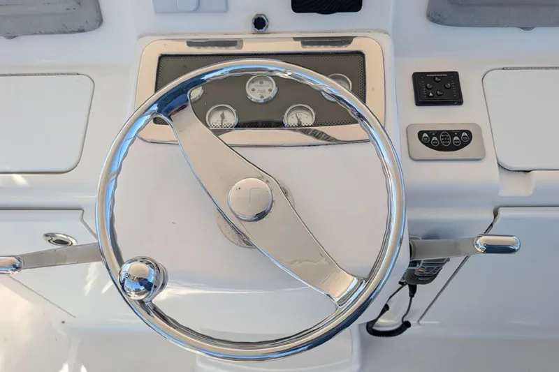Slide: The Image of Steering wheel and controls of a 2006 Tiara Yachts 3900 Convertible. - 14