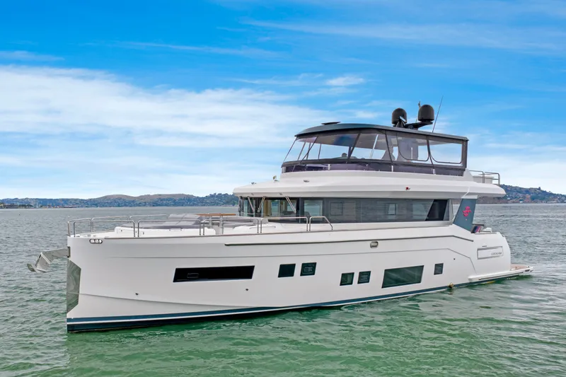 Slide: The Image of The 2020 Sirena 64 is a sleek motor yacht with a modern design and spacious deck. - 10