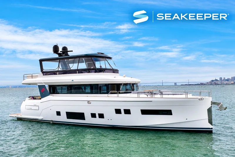 The Image of A luxurious white yacht, the Sirena 64, cruising on calm waters with a city in the background. - 0