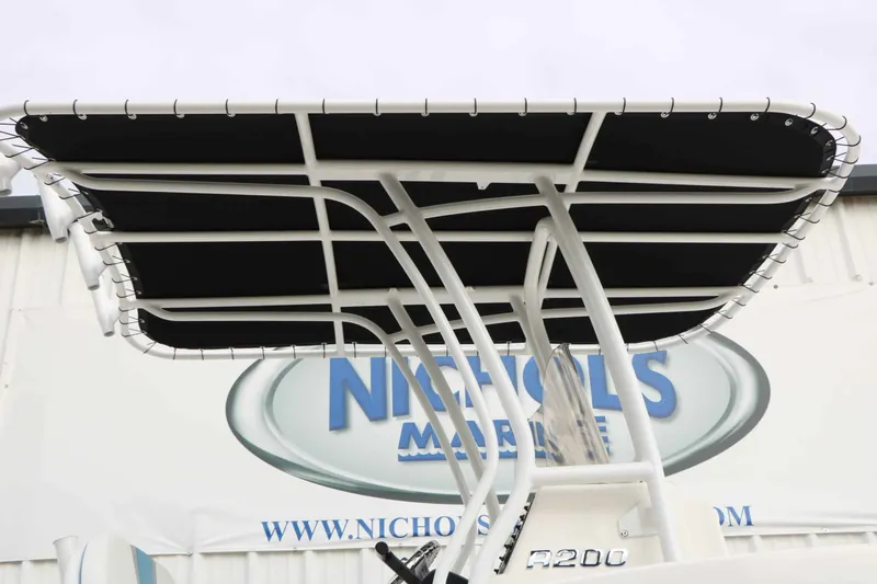 Slide: The Image of The image shows the T-top of a 2027 Robalo R200 Center Console boat. - 25