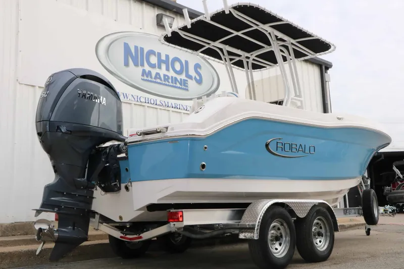 Slide: The Image of A 2027 Robalo R200 Center Console boat on a trailer, featuring a Yamaha outboard motor. - 15