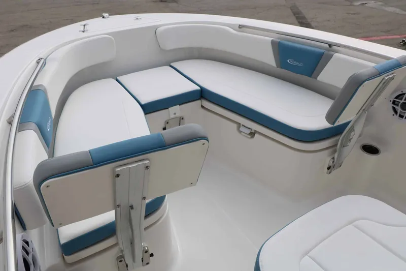 Slide: The Image of The 2027 Robalo R200 Center Console features spacious, cushioned seating in white and blue. - 29