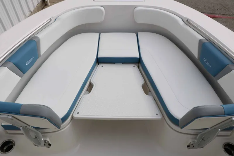 Slide: The Image of The 2027 Robalo R200 Center Console features a spacious, cushioned seating area at the bow. - 39