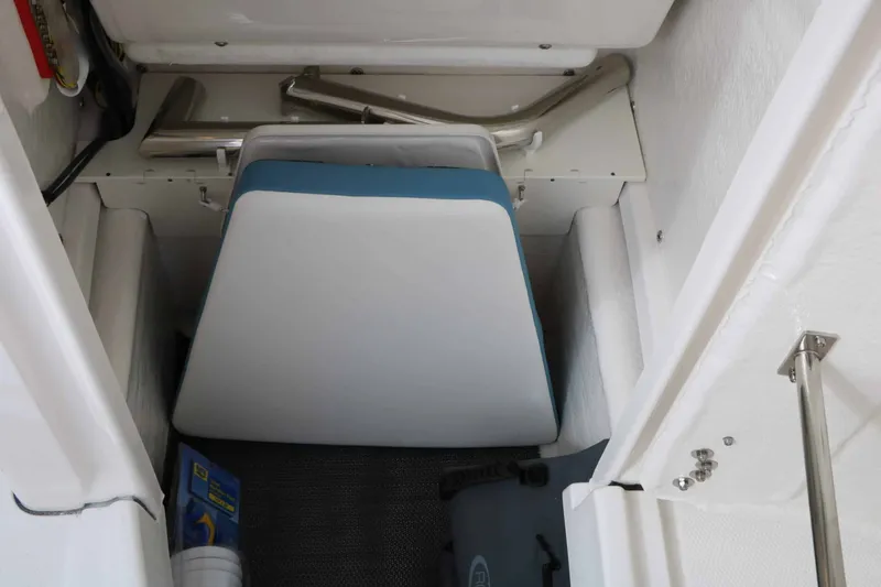 Slide: The Image of Interior of a Robalo R200 Center Console with seating and storage area. - 45