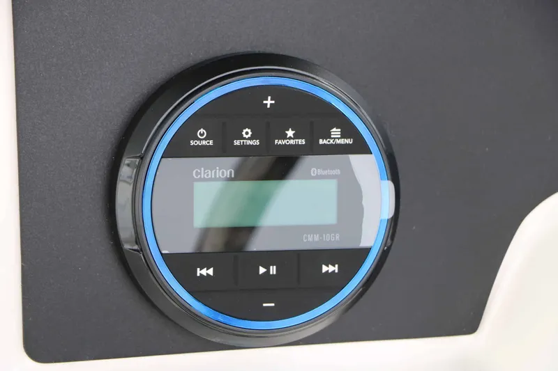 Slide: The Image of Round Clarion control panel with Bluetooth and control buttons. - 50
