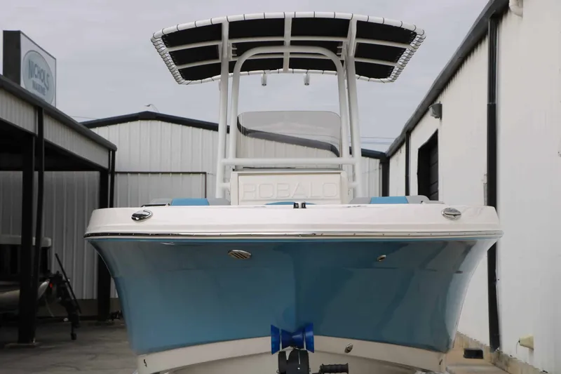 Slide: The Image of A 2027 Robalo R200 Center Console boat is parked in a storage area. - 11