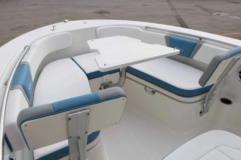 Slide: The Image of The 2027 Robalo R200 Center Console features a spacious seating arrangement with a convenient table. - 36