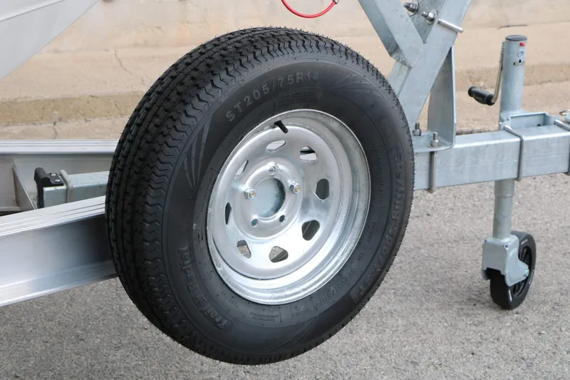 Slide: The Image of Close-up of a boat trailer wheel on asphalt. - 27