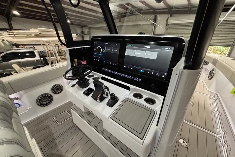 Slide: The Image of Modern Freeman 38 boat dashboard with advanced controls and touchscreen, 2025 model. - 15