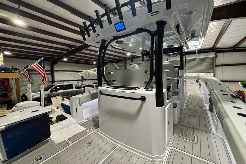 Slide: The Image of Interior view of a 2025 Freeman 38 boat in a garage setting. - 18