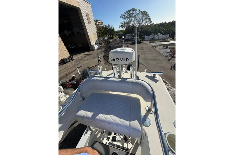 Slide: The Image of 2007 Andros 26 Tarpon boat with Garmin equipment, docked near a storage facility. - 17