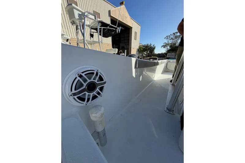 Slide: The Image of 2007 Andros 26 Tarpon boat interior with speaker, docked near a building. - 14