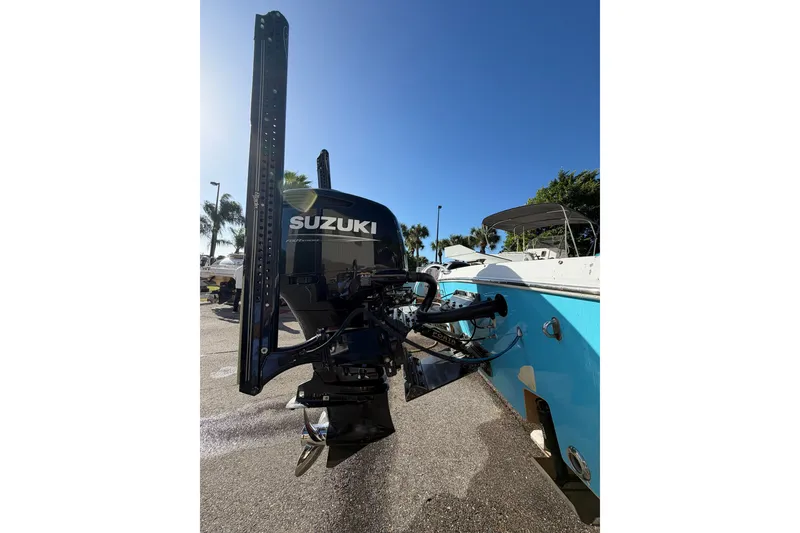 Slide: The Image of 2007 Andros 26 Tarpon boat with Suzuki outboard motor in sunny marina setting. - 26