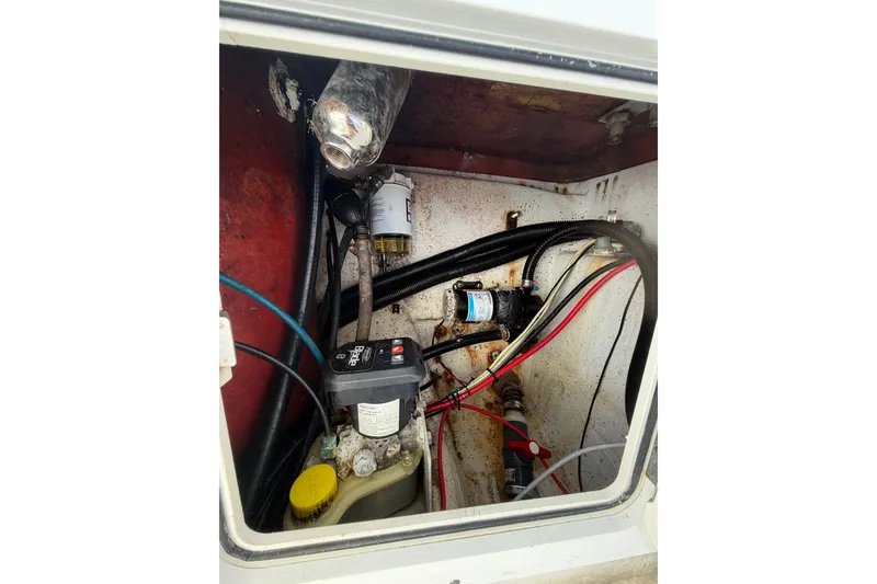 Slide: The Image of Electrical and mechanical components inside a 2007 Andros 26 Tarpon boat compartment. - 30