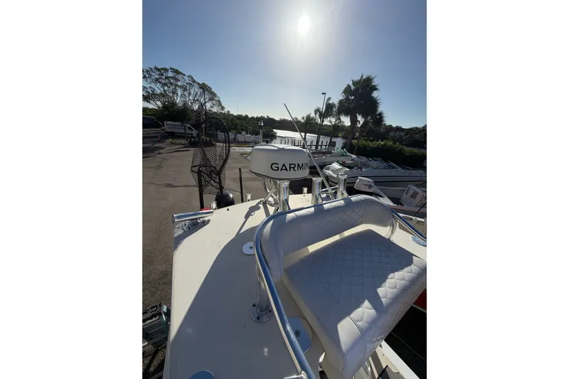 Slide: The Image of 2007 Andros 26 Tarpon boat with Garmin equipment, docked under a sunny sky. - 18
