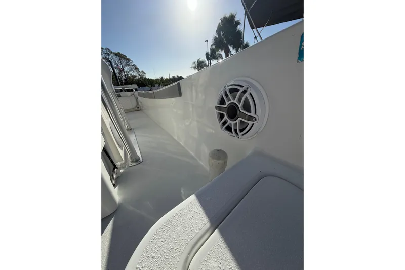 Slide: The Image of 2007 Andros 26 Tarpon boat deck with speaker, under sunny sky. - 15