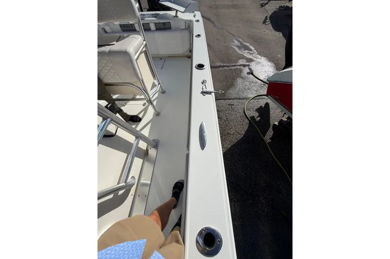 Slide: The Image of 2007 Andros 26 Tarpon boat deck with seating and rod holders. - 21