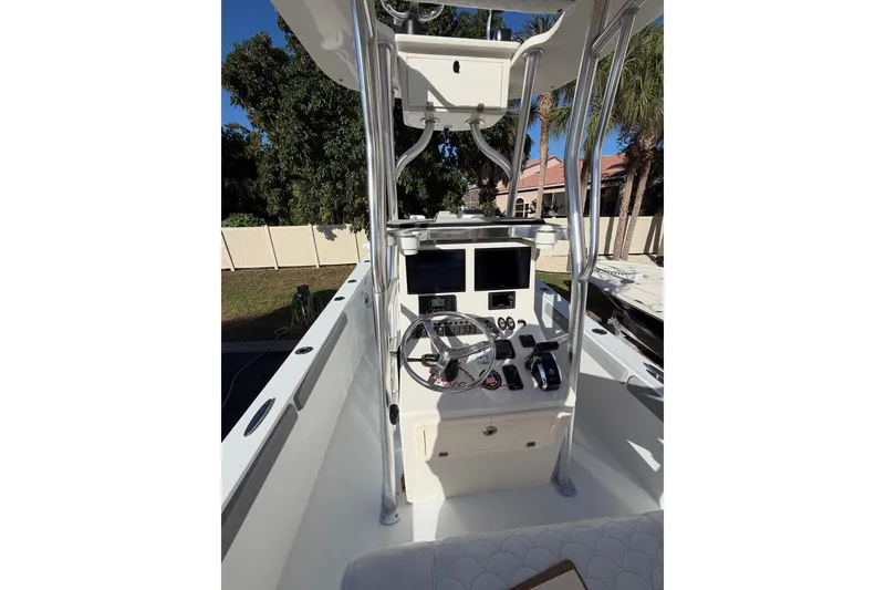 Slide: The Image of 2007 Andros 26 Tarpon boat console with steering wheel and dual screens. - 7